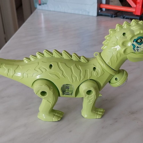 Dinosaur toy like new, walks, lights, and makes sounds, 28cm