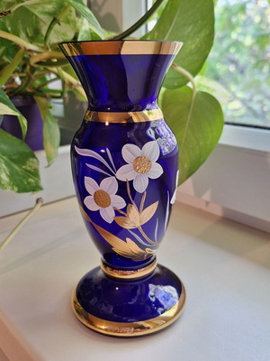 Blue vase with gold ornaments like new, solid glass