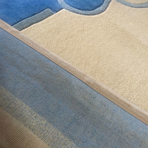 Embossed rug used, blue and beige, 1.97x1.40 m
