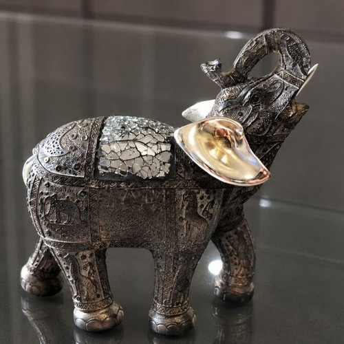 Decorative elephant vintage with embossed Asian-inspired carvings used