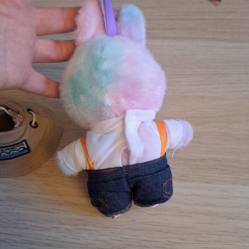 Labubu doll with pastel pink, purple, and blue clothes like new