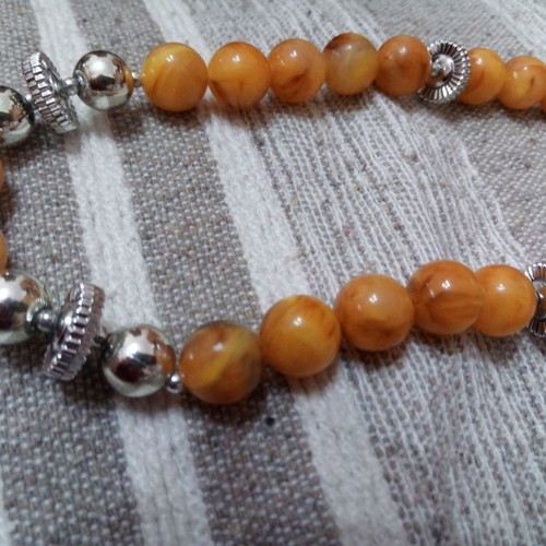 Vintage bakelite necklace used honey color with metal details