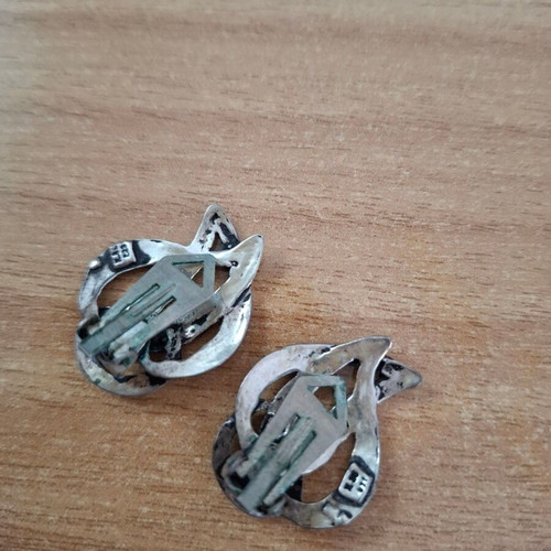 Vintage metal earrings used with abstract artistic design silver