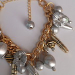 Bracelet silver and gold with charms new