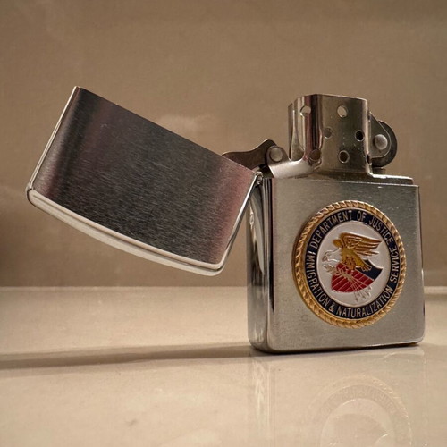 Zippo collectible lighter new with Department of Justice DOJ FBI case