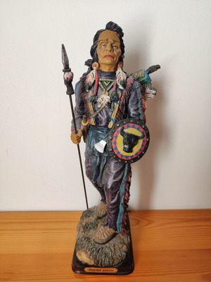 Vintage decorative statue of Native American warrior with spear, shield, and axe used