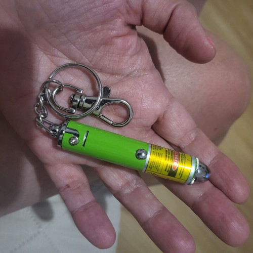 Laser flashlight keychain like new with 2 batteries