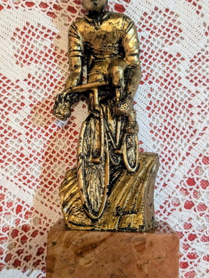Vintage decorative cyclist figurine on marble base