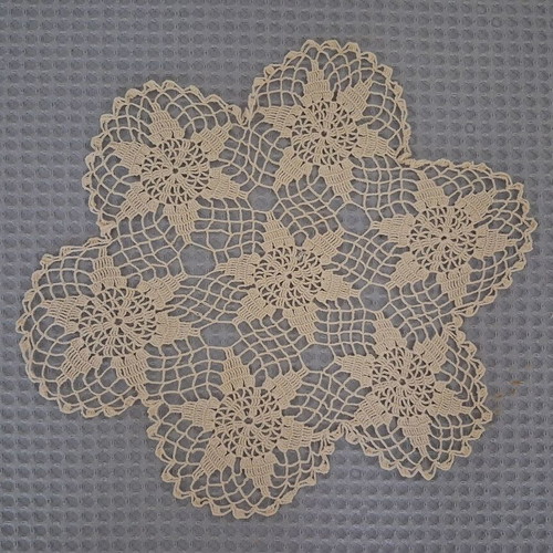 Round beige doily used, diameter 29 cm