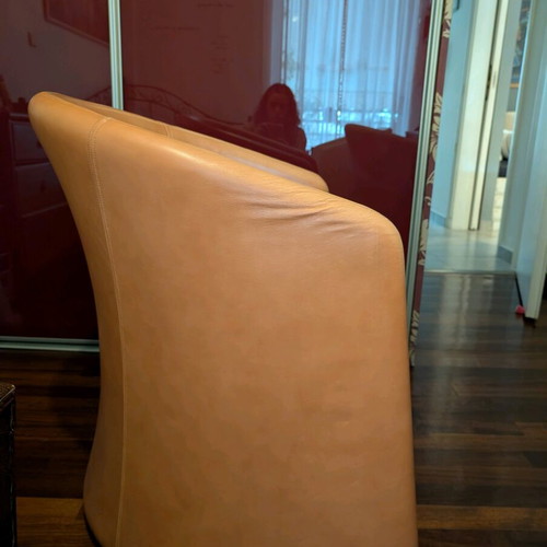 Leather armchairs used, 3 pieces, 1 orange and 2 ecru