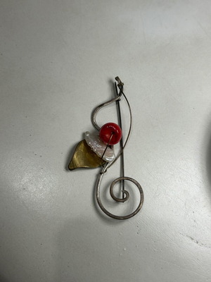 Alternative metal pin used, red and gold colors