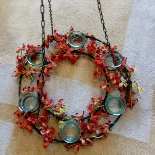 Decorative metal wreath like new with glass candle holders