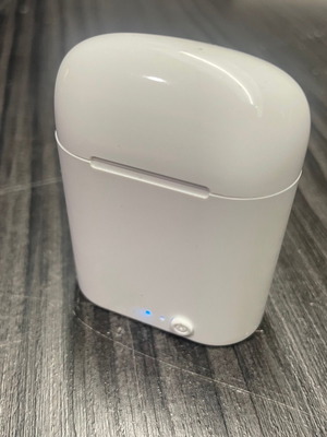 Wireless earbuds white used with charging case