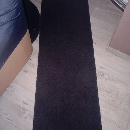 Black interior vintage runner rug used, minimalist design