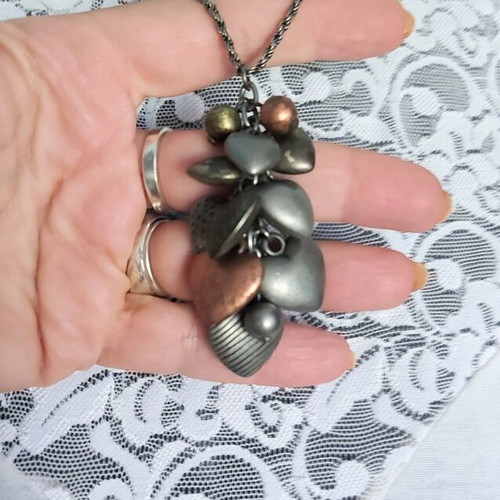 Choker necklaces like new with black ornaments, mother-of-pearl flowers and hearts