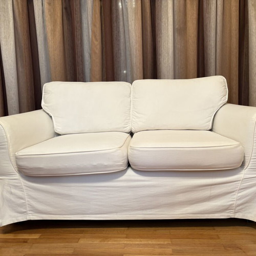 Two-seater sofa with white fabric cover like new