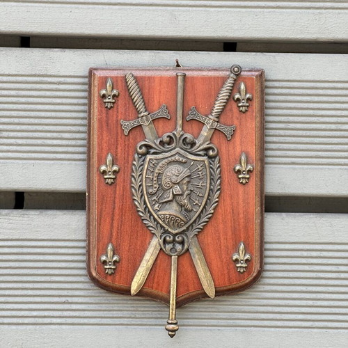 Vintage wooden wall shield with metal coat of arms, swords & fleur-de-lis used
