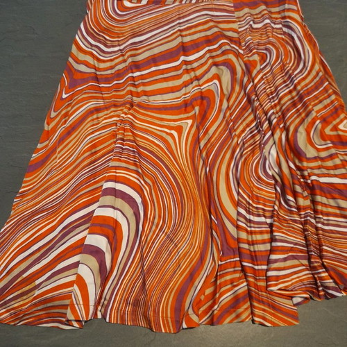 Batida skirt used with color blocking in purple, orange, beige, white