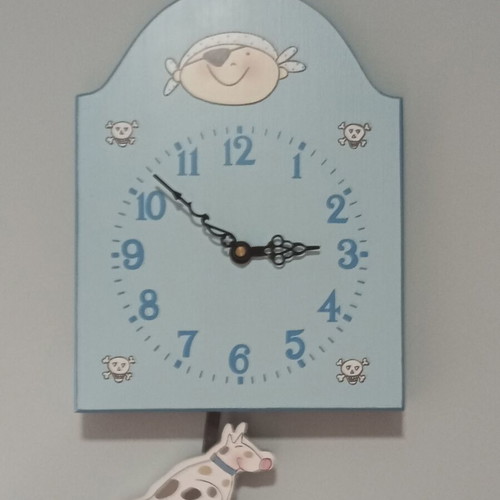Blue wall clock used for kids room with pirate and dog design