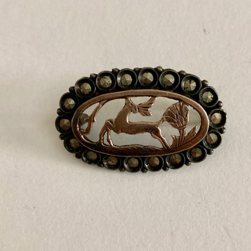 Silver brooch with gold and marcasites