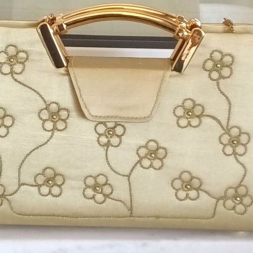 Small gold handbag with handle and long chain, like new