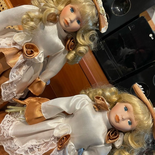 Vintage porcelain dolls like new