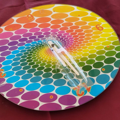 Glass pop art wall clock with spiral design and vibrant colors