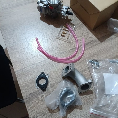 Carburetor 24mm new with extra needle, jet, neck, screws, and rubber mouth