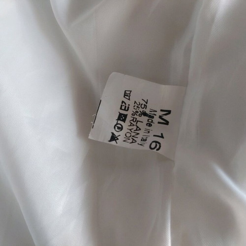 White jacket used, mid-length with 3/4 sleeves, 70% wool