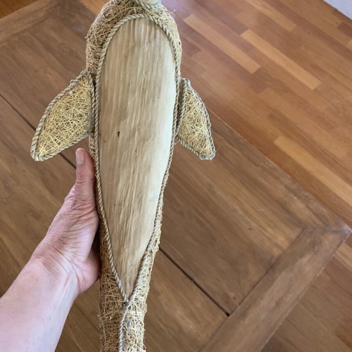 Handmade decorative dolphin made of grass