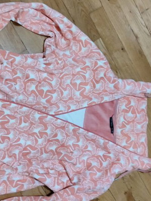 Pink cardigan used with white patterns and zipper, size L