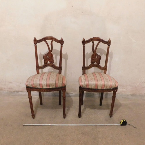 Pair of carved wooden chairs with striped fabric seat like new