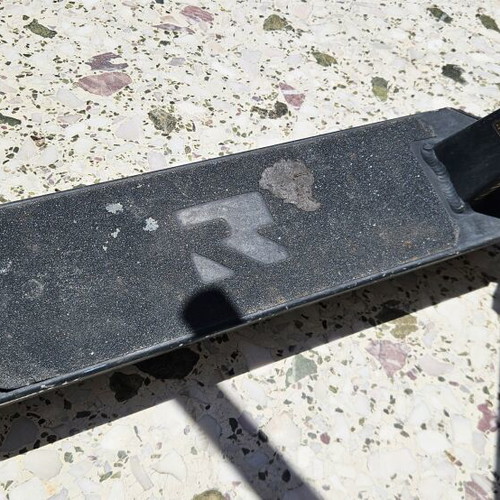 Root Industries Invictus Gold Rush freestyle scooter used with helmet and pads