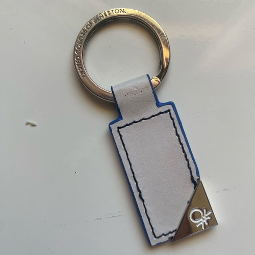 Benetton keychain like new, white and blue