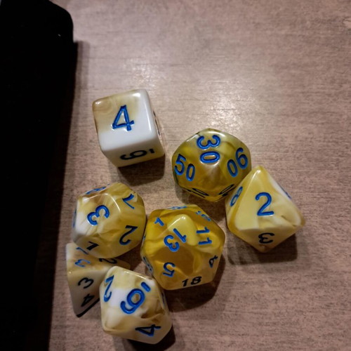 Black leather runic dice bag with yellow marbled D&D dice