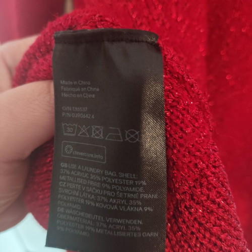 Red H&M sweater with glitter, like new, size M