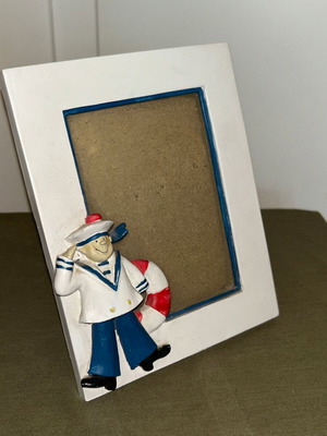 Nautical themed table photo frame with sailor and lifebuoy, polyresin