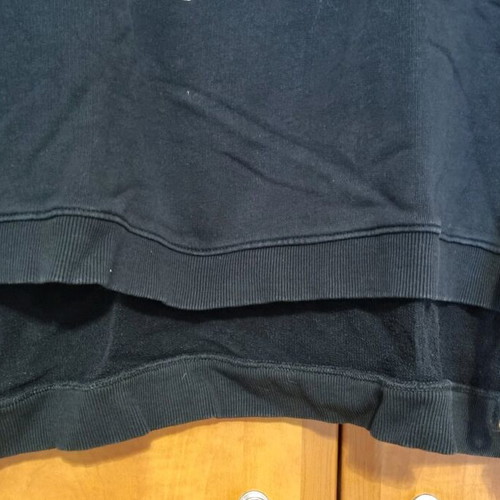 Black sweatshirt used with unique sleeves and asymmetrical design