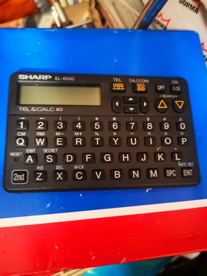 Sharp calculator used in good condition
