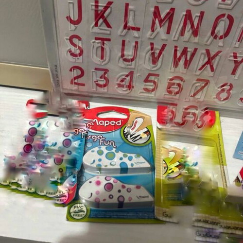 Maped school supplies set with alphabet stencil, erasers, sharpener