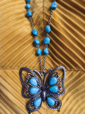 Long handmade necklace used, turquoise butterfly pendant