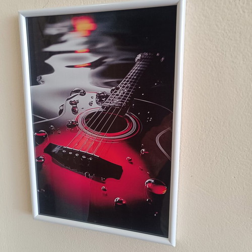 Decorative frame 30×20 cm with guitar theme like new