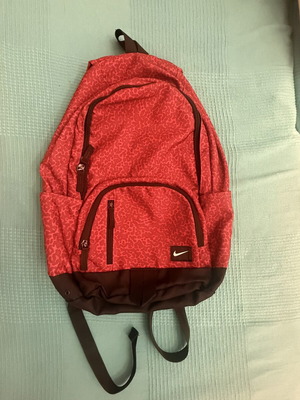 Nike backpack with one broken zipper, like new, black and red