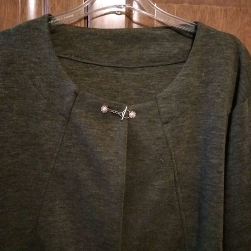 Short cardigan new in olive with gold flower and pearl, size L