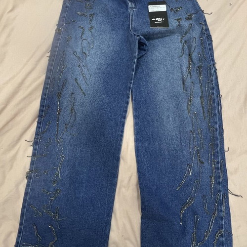 Colcci high-waisted blue denim jeans with chain and rhinestone details