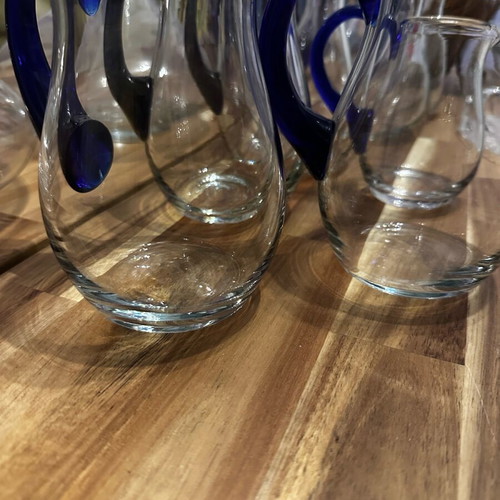 Set of 10 blown glass pitchers like new with cheese platter