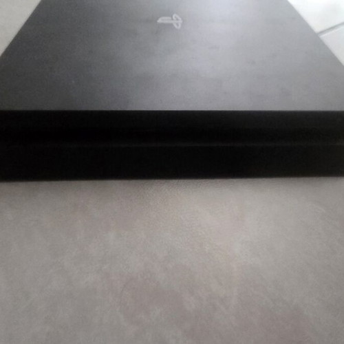 PlayStation 4 Slim 1TB console like new, chipped
