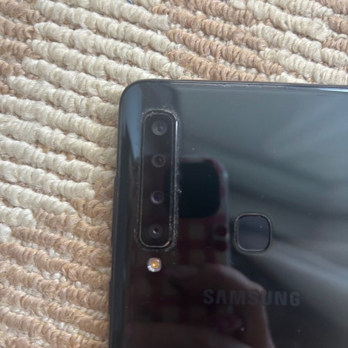 Samsung Galaxy A9 used with case and 4 screen protectors