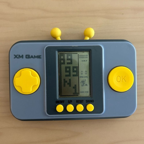 Vintage XM Game handheld console with multiple games