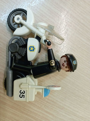 Playmobil police figure with motorcycle like new